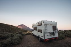 Camper parked in desert landscape