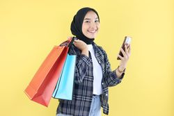 Asian Indonesian Young Woman Happy Face after Online Shopping