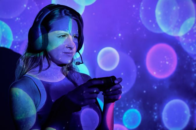 Displeased female gamer using controller