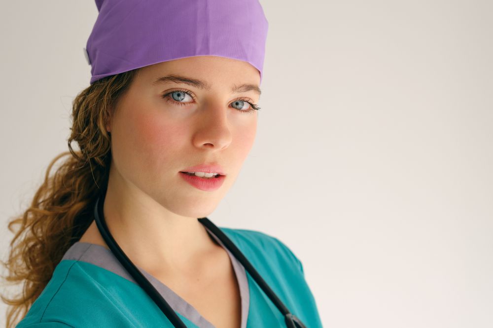Female doctor in workwear in studio