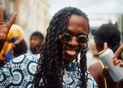 London, England, United Kingdom - August 28, 2022: Portrait of man with beer and sunglasses