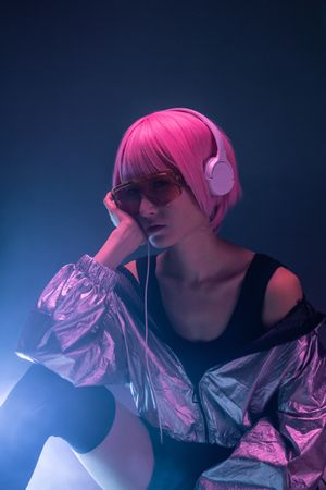 Woman sitting and listening to music