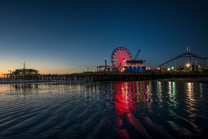 Santa Monica pier illuminated at dusk