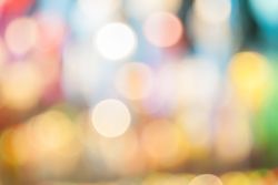 Defocused abstract bokeh lights christmas background, blur of bokeh circle light christmas festive backdrop concept.