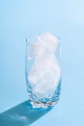 Empty glass with ice cubes