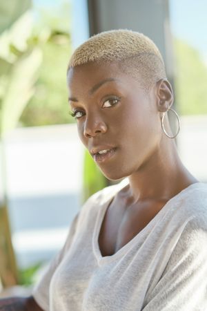 Stylish Black woman looking at camera