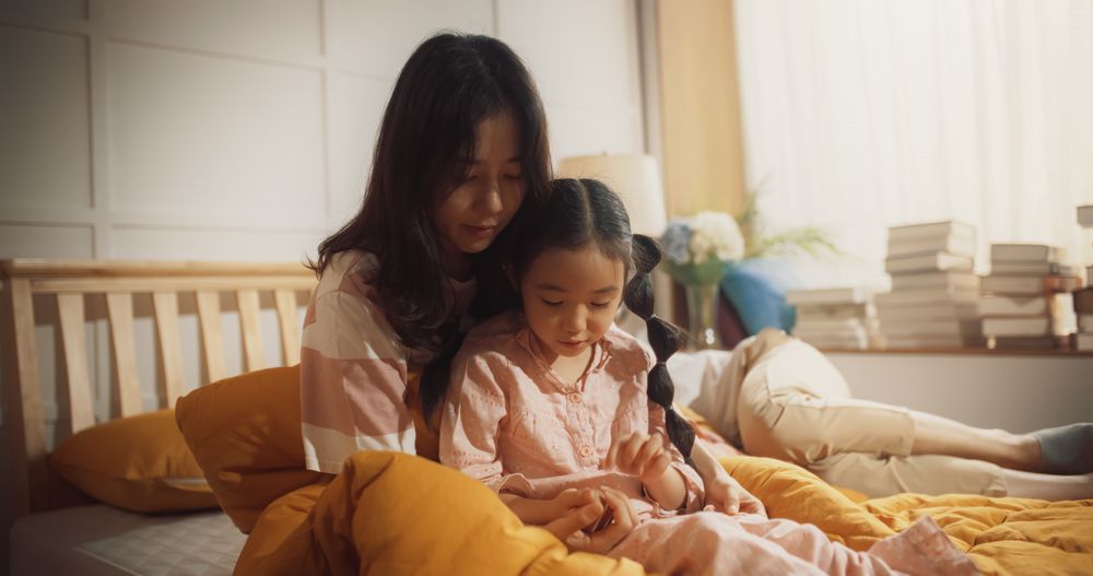 Korean Mother and her Daughter Having a Peaceful Morning Together, Talking and Bonding.