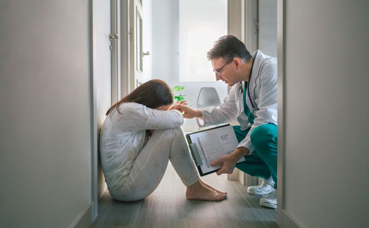 Psychiatrist trying to help with empathy a patient who refuses help