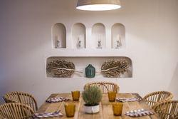 Served table with burning lamps above