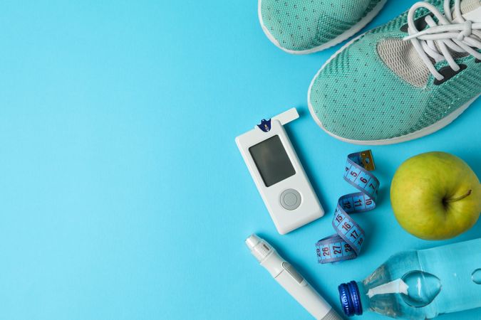 Concept of a healthy diabetic on blue background. Sports diabetic
