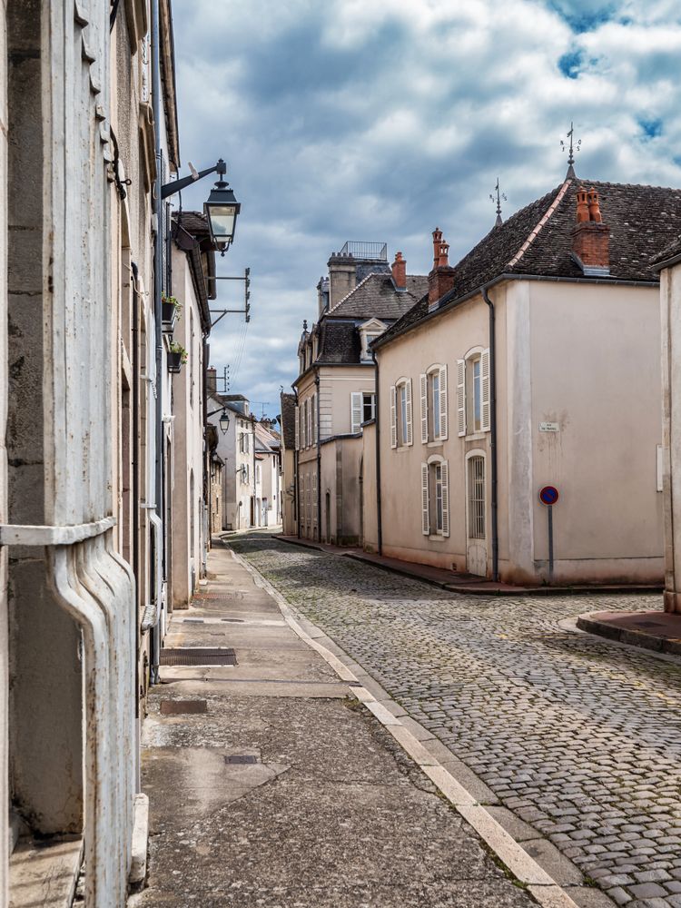 Empty streets of the medieval city of Beaune in Burgundy. The stormy sky