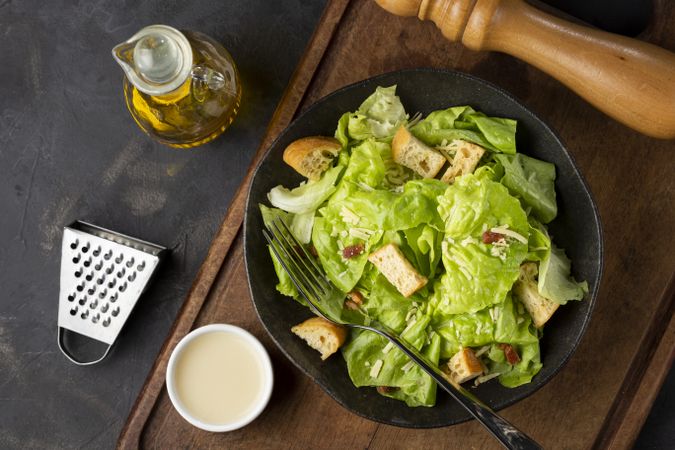 Caesar salad with croutons and bacon.