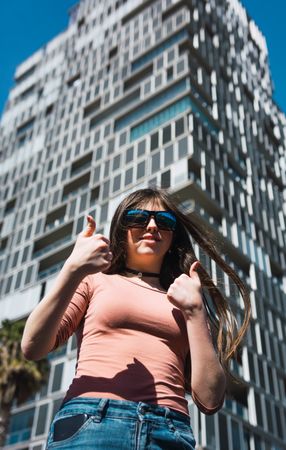 Portrait of 16 year old girl making funny gestures.