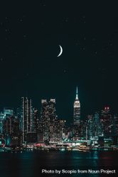 Crescent moon in New York city skyline during night time bGJxx4