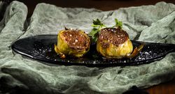 Delicious baked artichokes on plate
