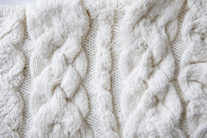 Close-up of creamy cable knit textile
