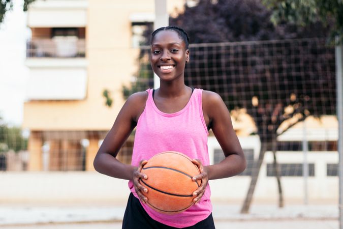 Portrait of Female Basketball Player Holding Ball