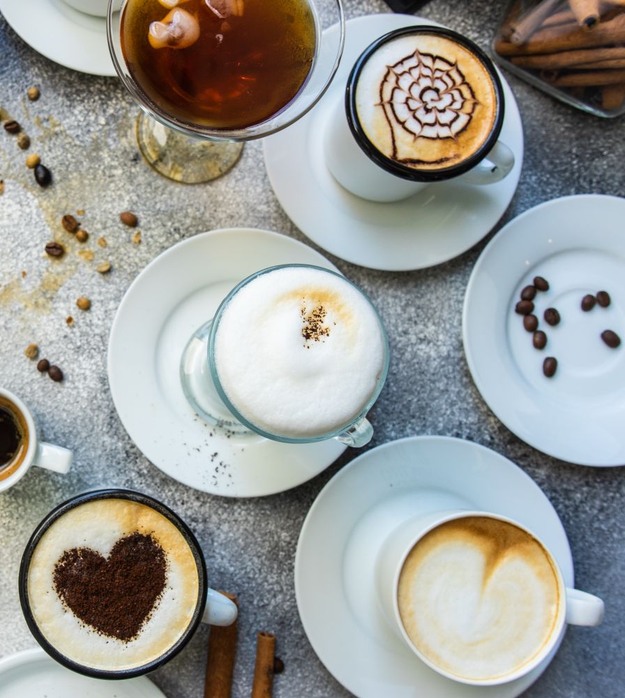 Top view of different coffees with foam art