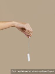 Hand holding tampon front view 4m9AW4