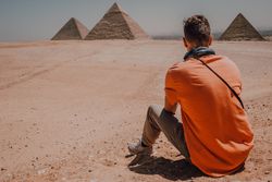 Young man against Great Pyramids