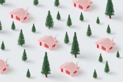 Christmas pattern made with pink houses and pine trees