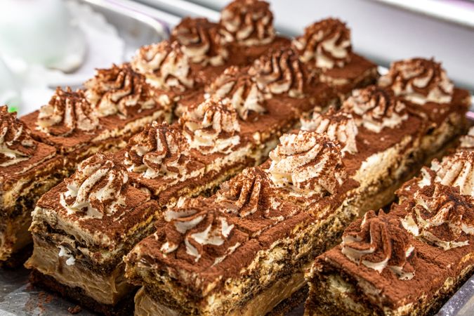 Traditional tiramisu cake slices decorated whipped cream chocolate powder italian dessert pastry fresh