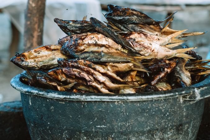 Bowl with heap of dried fish
