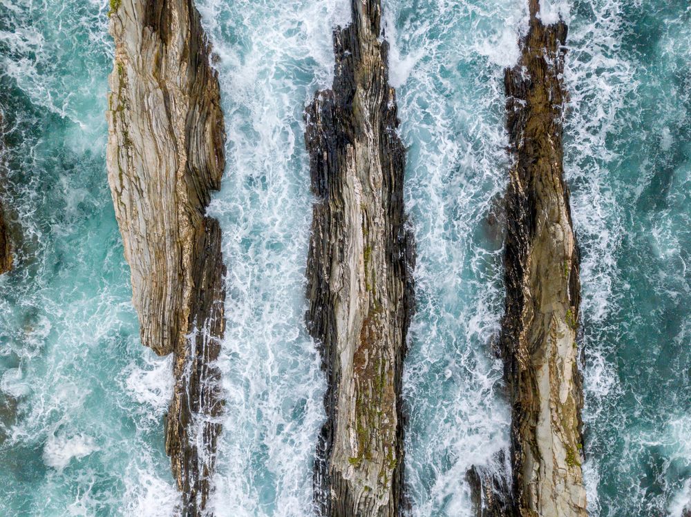 Stone ridges on high seas in stormy day