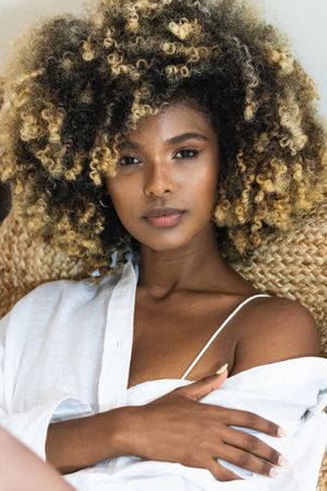 Gentle Black woman touching bare shoulder