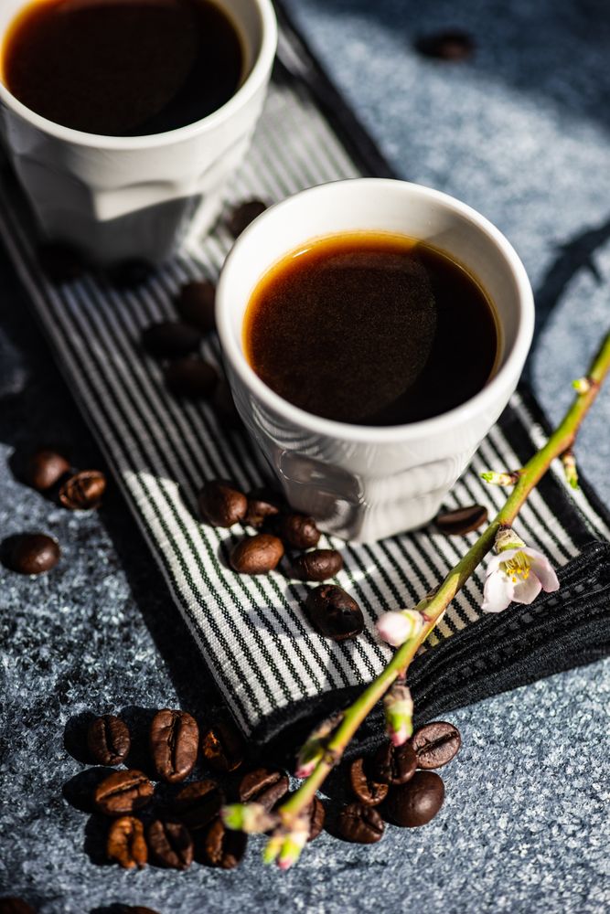 Cups of espresso on counter