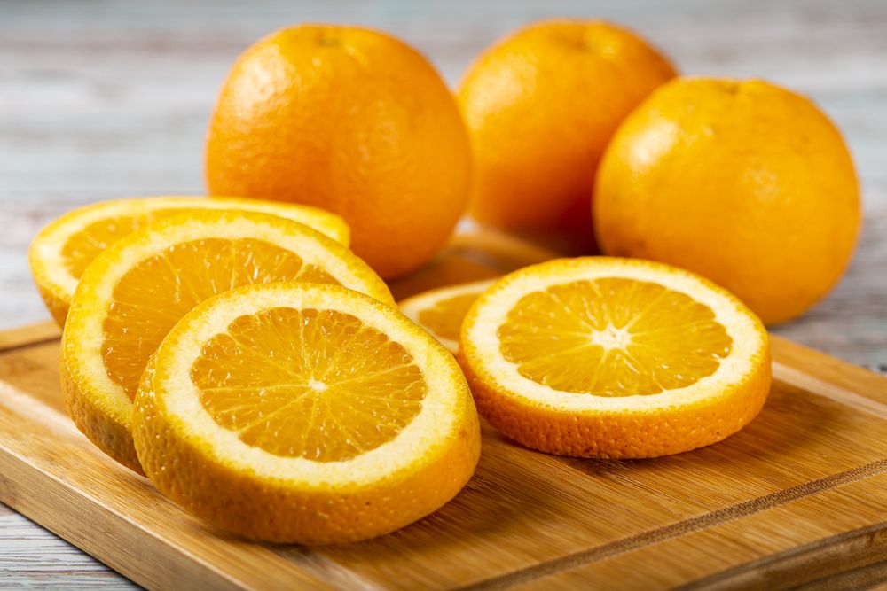 Sliced oranges on the table.