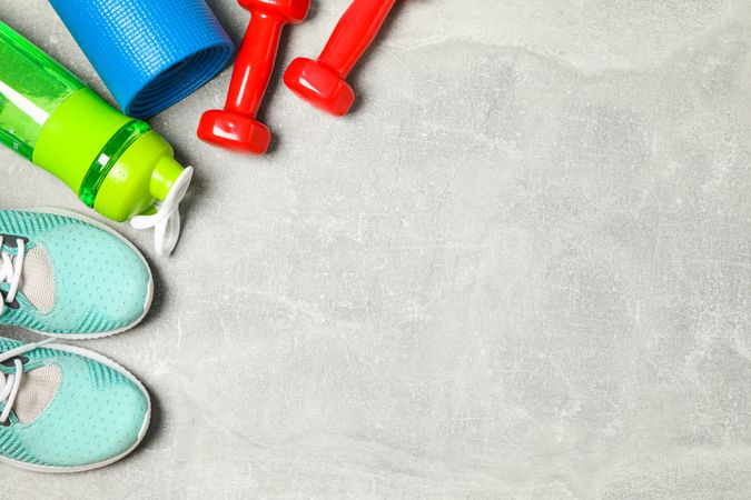 Flat lay composition with healthy lifestyle accessories on grey background