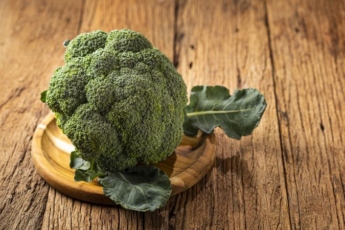 Green organic broccoli on the table.