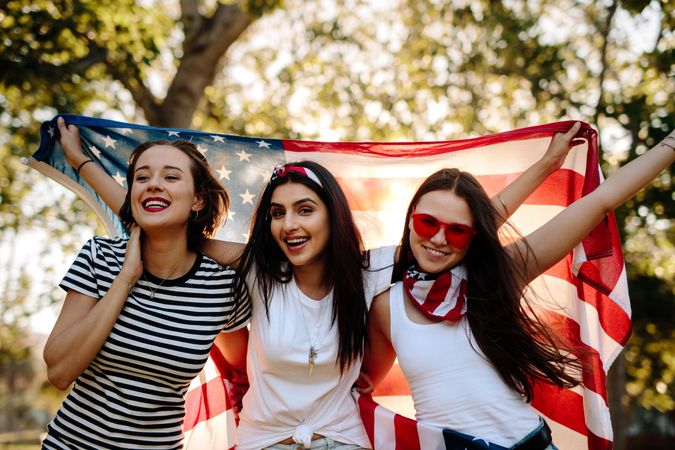 Group of young women smiling with American flag