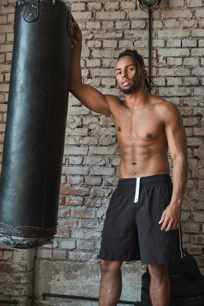 Confident Black boxer in gym