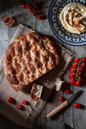 Ramazan pidesi near spices and tomatoes