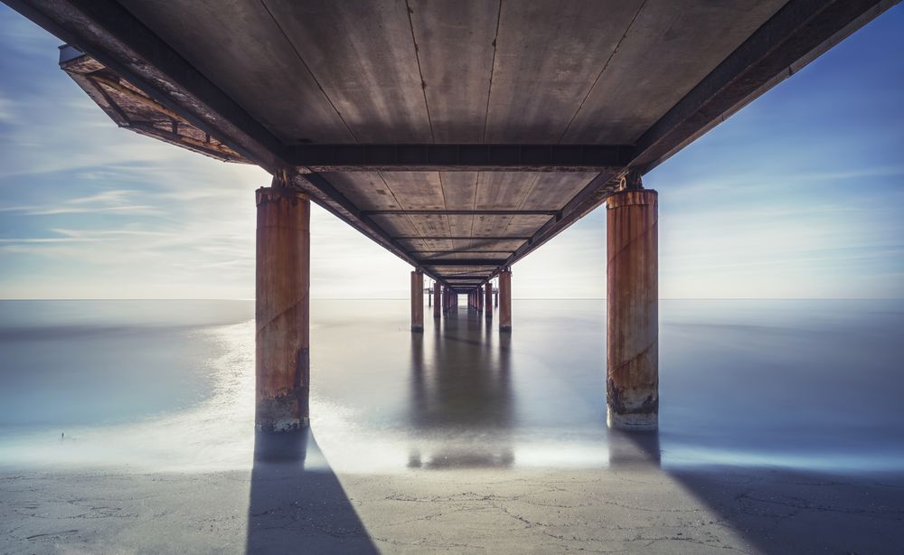 Pier seen from below, beach and sea in Marina di Pietrasanta, Versilia Tuscany Italy