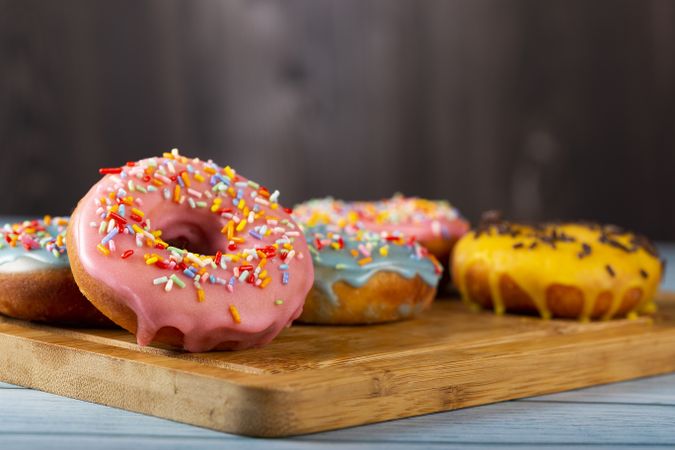 Delicious assorted colorful donuts on the table.