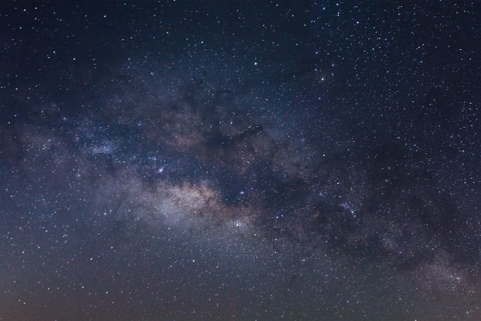 The center of the milky way galaxy with stars and space dust in the universe, Long exposure photograph, with grain