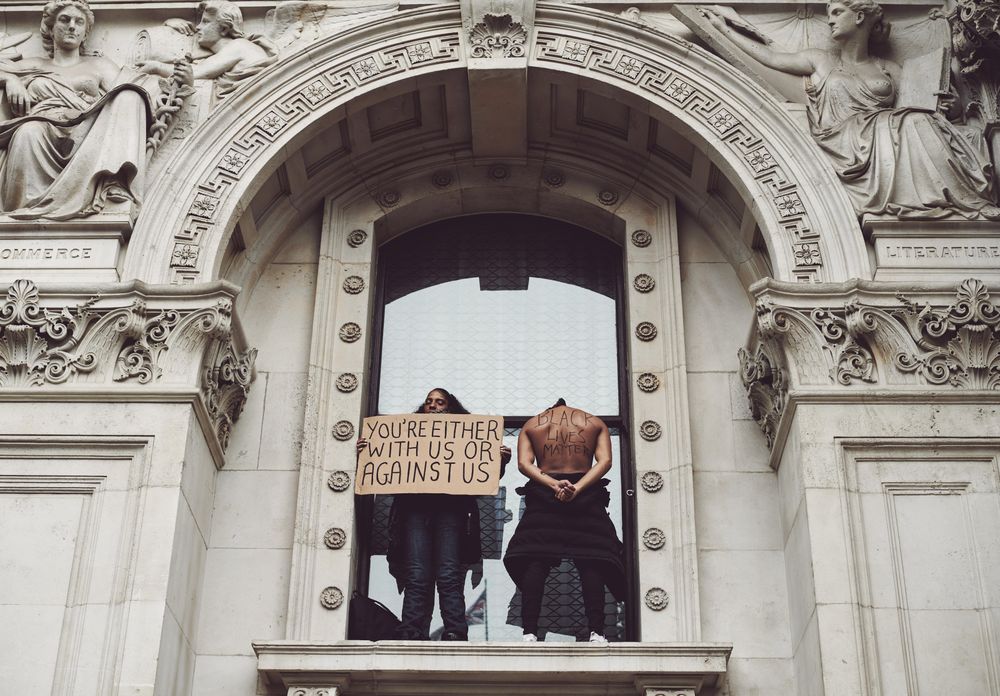 London, England, United Kingdom - June 6th, 2020: Two protesters standing in arch