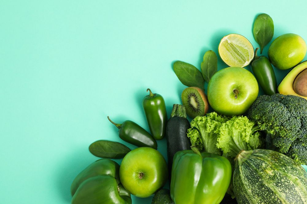 Fresh vegetables and fruits on mint background