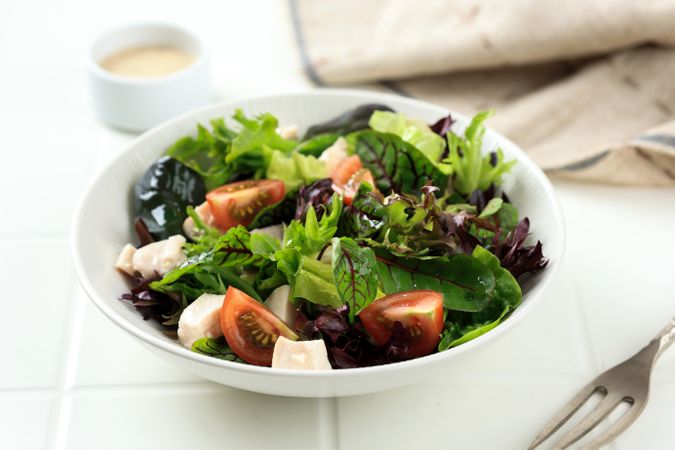 Healthy Salad Lettuce, Red Spinach, Cubed Boiled Chicken, Tomato, with Creamy Dressing.