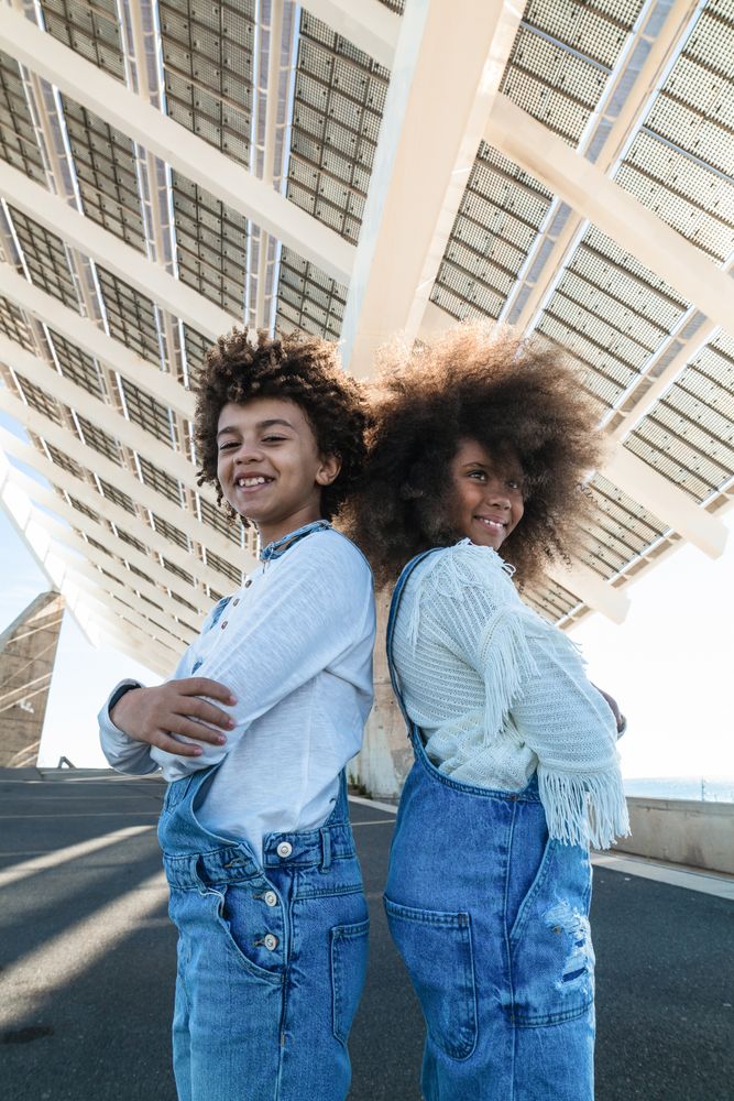 Cheerful Black teenagers in denim outfits