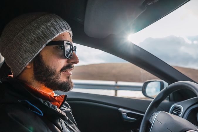 Man driving car in Faroe Islands