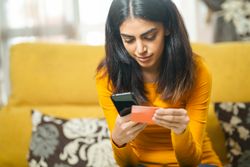 Woman using her phone to shop online