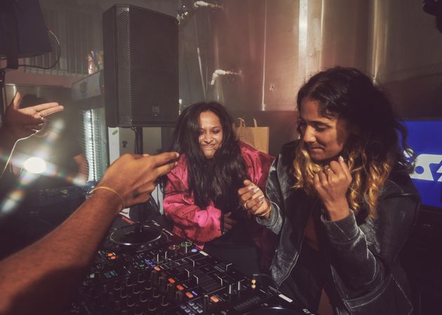 London, England, United Kingdom - Nov 9, 2022: Two female DJs having a good set in London
