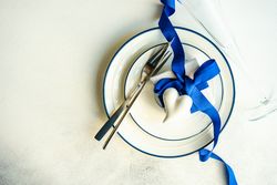 Top view of table setting with blue Valentine theme with space for text