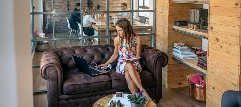Woman working with laptop in a coworking office
