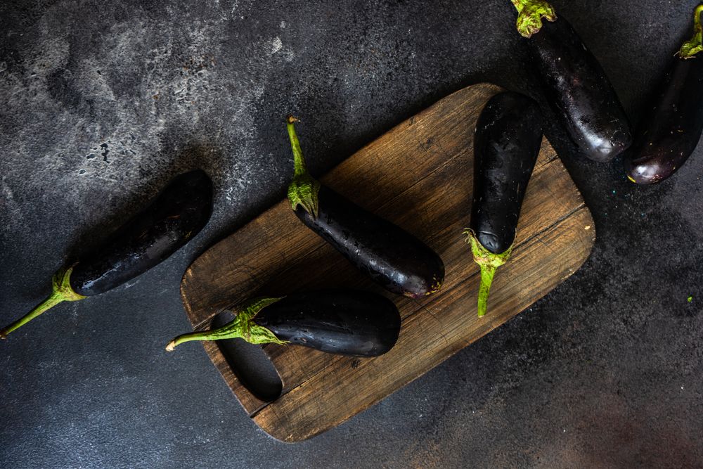 Eggplants on cutting board
