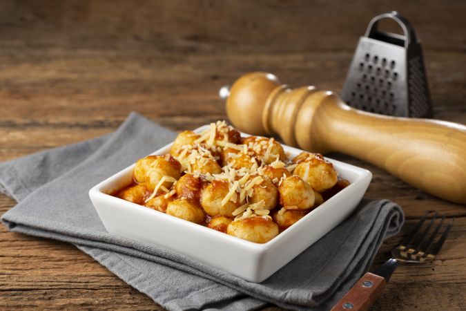 Gnocchi with tomato sauce and grated Parmesan cheese.